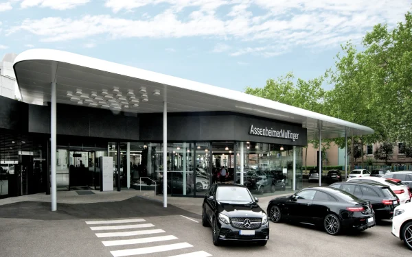German car dealership utilizing Laminam Calce Nero Italian porcelain, offering sleek black surfaces that complement the contemporary showroom design.