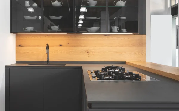 Kitchen countertops crafted from Laminam Calce Nero Italian porcelain, providing sleek black surfaces for a contemporary look.