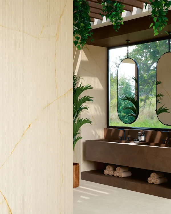 Bathroom walls adorned with Laminam Diamond Cristallo Gold Italian porcelain slabs, showcasing luminous white surfaces with delicate gold veining for an opulent finish.