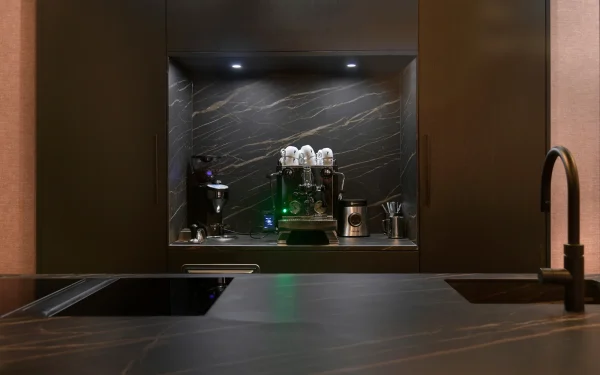 European custom home interiors featuring Laminam Noir Desir porcelain surfaces; luxurious deep black slabs with elegant ivory and gold veining, showcasing Italian craftsmanship and sophisticated design.