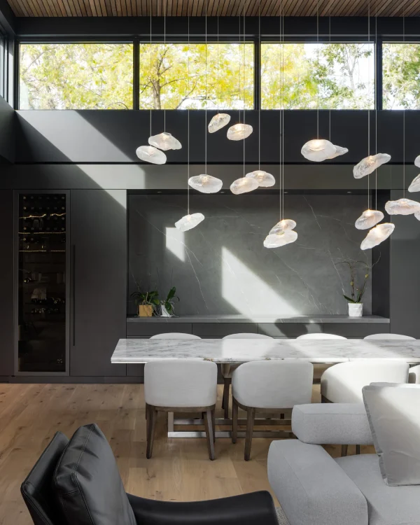 Modern kitchen design utilizing Laminam Pietra Grey Italian porcelain; sleek grey surfaces with subtle veining offering a contemporary and elegant aesthetic.