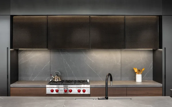 Modern kitchen design utilizing Laminam Pietra Grey Italian porcelain; sleek grey surfaces with subtle veining offering a contemporary and elegant aesthetic.