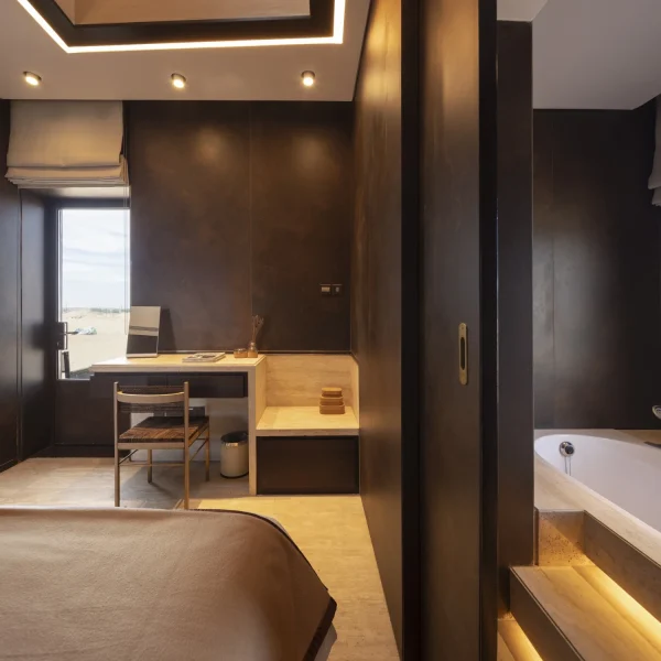 Luxury lodge interiors adorned with Laminam Ossido Bruno Italian porcelain; rich brown surfaces with textured finishes adding depth and warmth to the space.