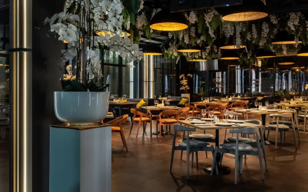 Luxury restaurant interiors featuring Laminam Ossido Bruno porcelain surfaces; rich brown slabs with an oxidized metal aesthetic, providing a sophisticated and contemporary ambiance.