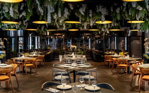 Luxury restaurant interiors featuring Laminam Ossido Bruno porcelain surfaces; rich brown slabs with an oxidized metal aesthetic, providing a sophisticated and contemporary ambiance.