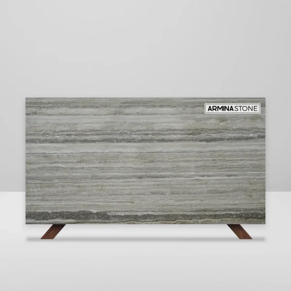 Honed filled Travertino Romano slab in dark grey and grey tones; stylish for residential and commercial interiors in Miami.